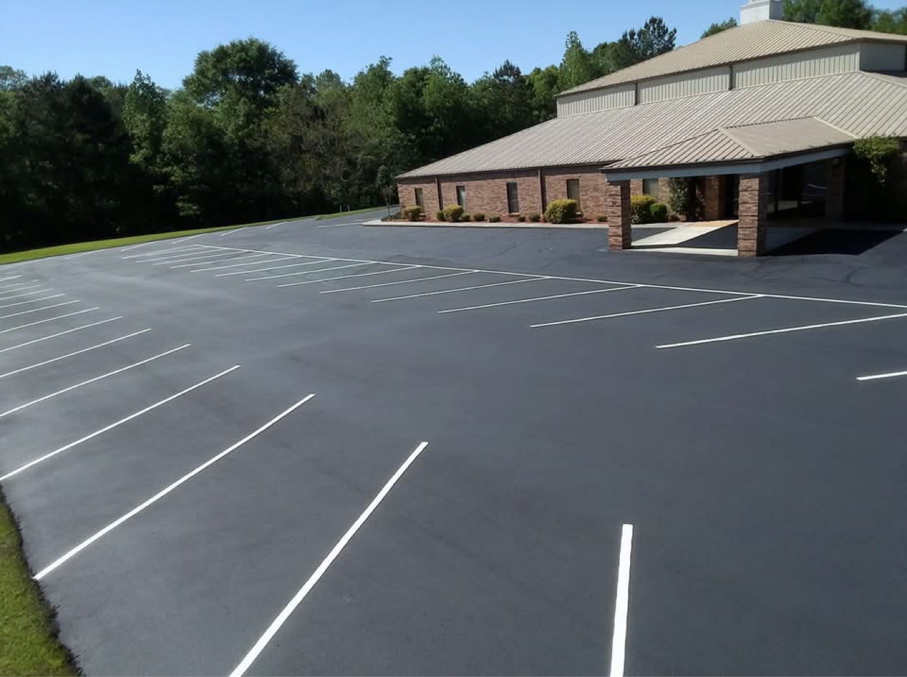 Fresh sealcoating and striping on a commercial parking lot