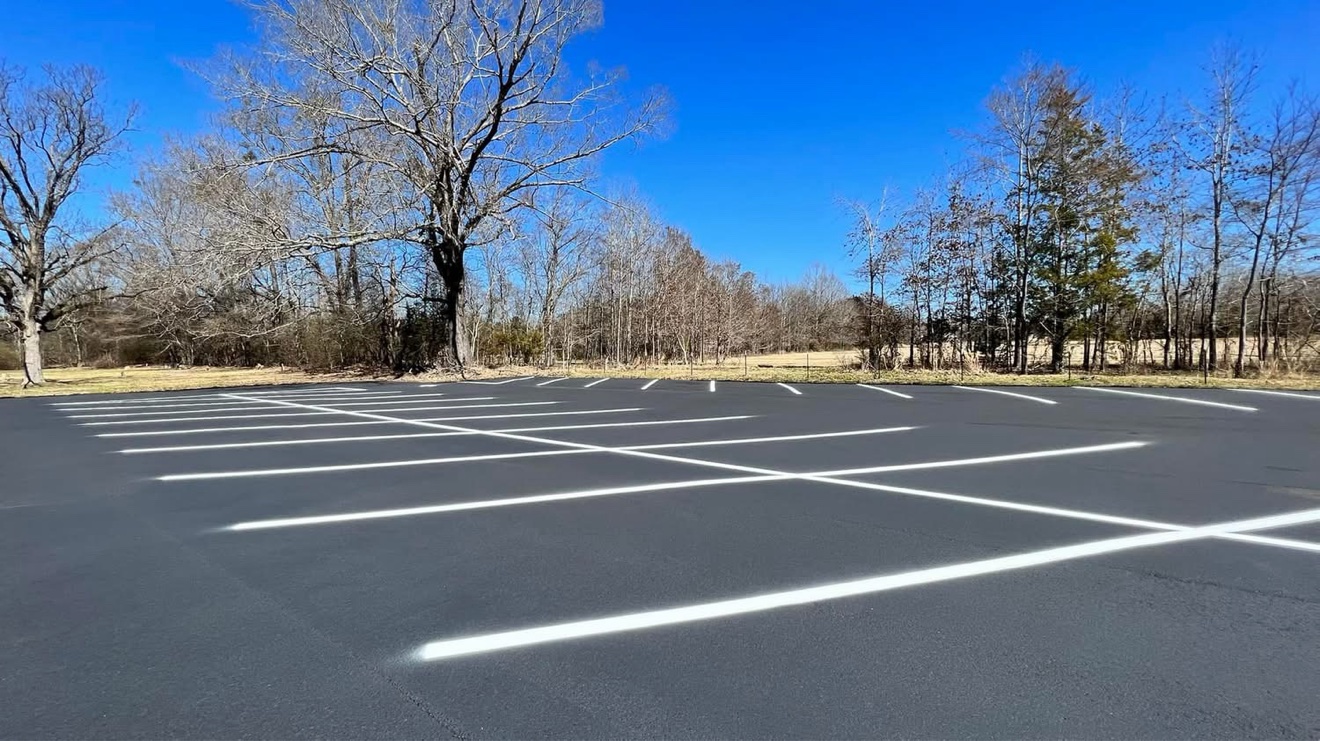 Freshly sealcoated parking lot with clean striping